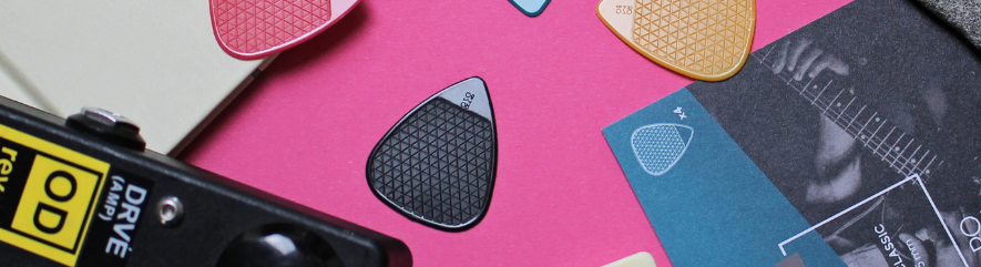 An assortment of guitar picks and other guitar accessories 