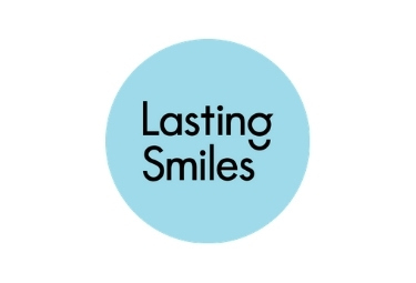 Lasting Smiles Logo, Light Blue circle, Black Lettering